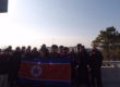 Our tourgroup holding a North Korean flag at the DMZ