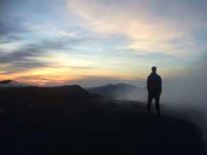 Haakon looking at the sunrise from the crater of Telica